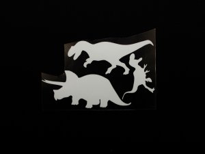 Transfer-Applikation zum Aufbügeln ca. 7,5 cm x 3 cm - Glow in the Dark - 3 Dinosaurier - weiß 